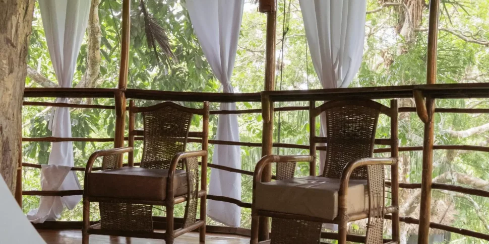 Seating area inside casa alta treehouse at the treehouse lodge in peru.